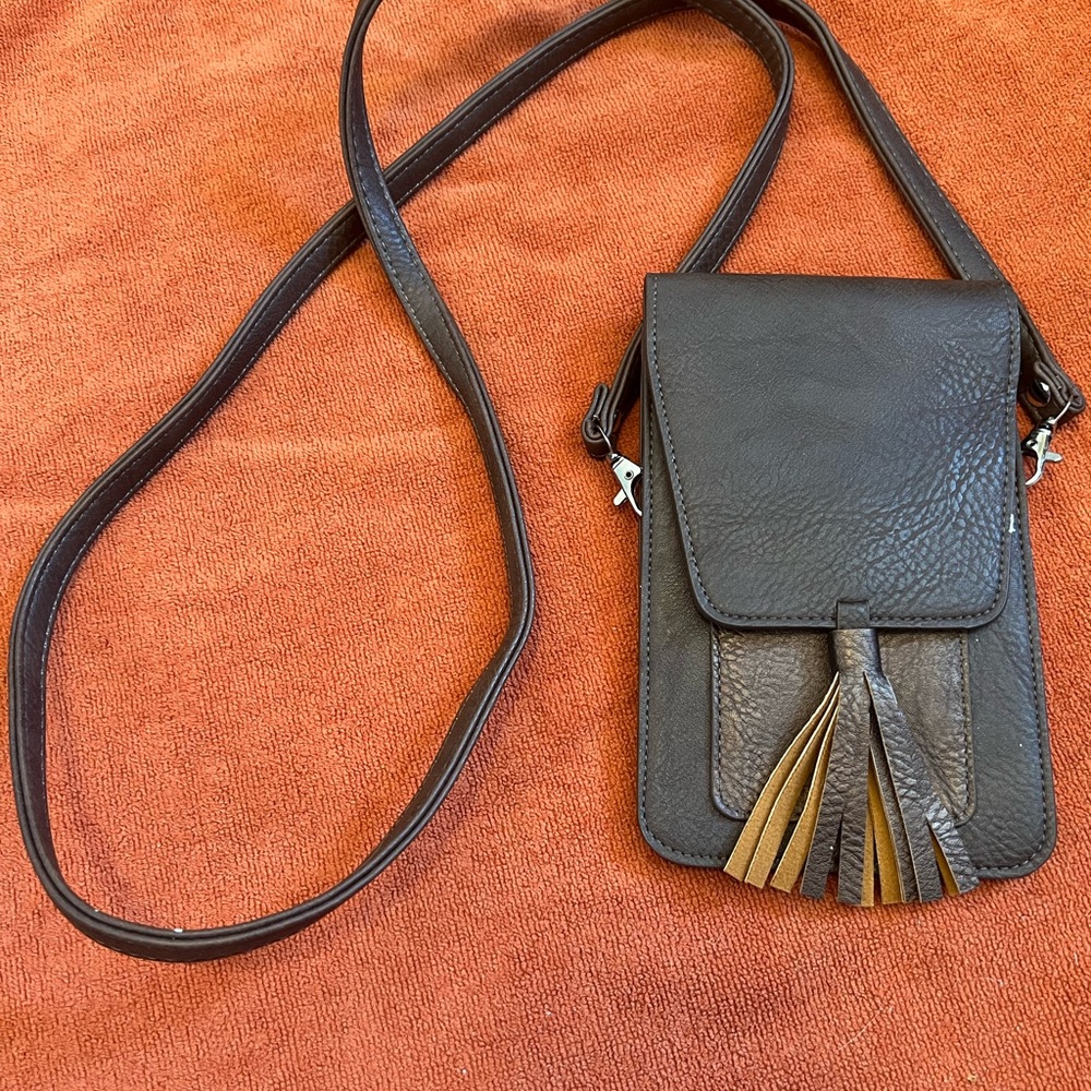 Brown Leather Crossbody Bag with Flap Closure and Tassel
